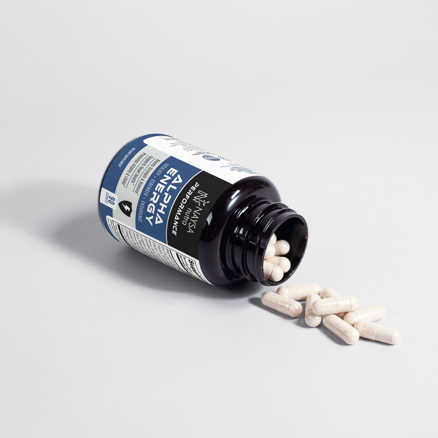 Bottle of alpha Energy supplements with pills spilling out on a light gray background