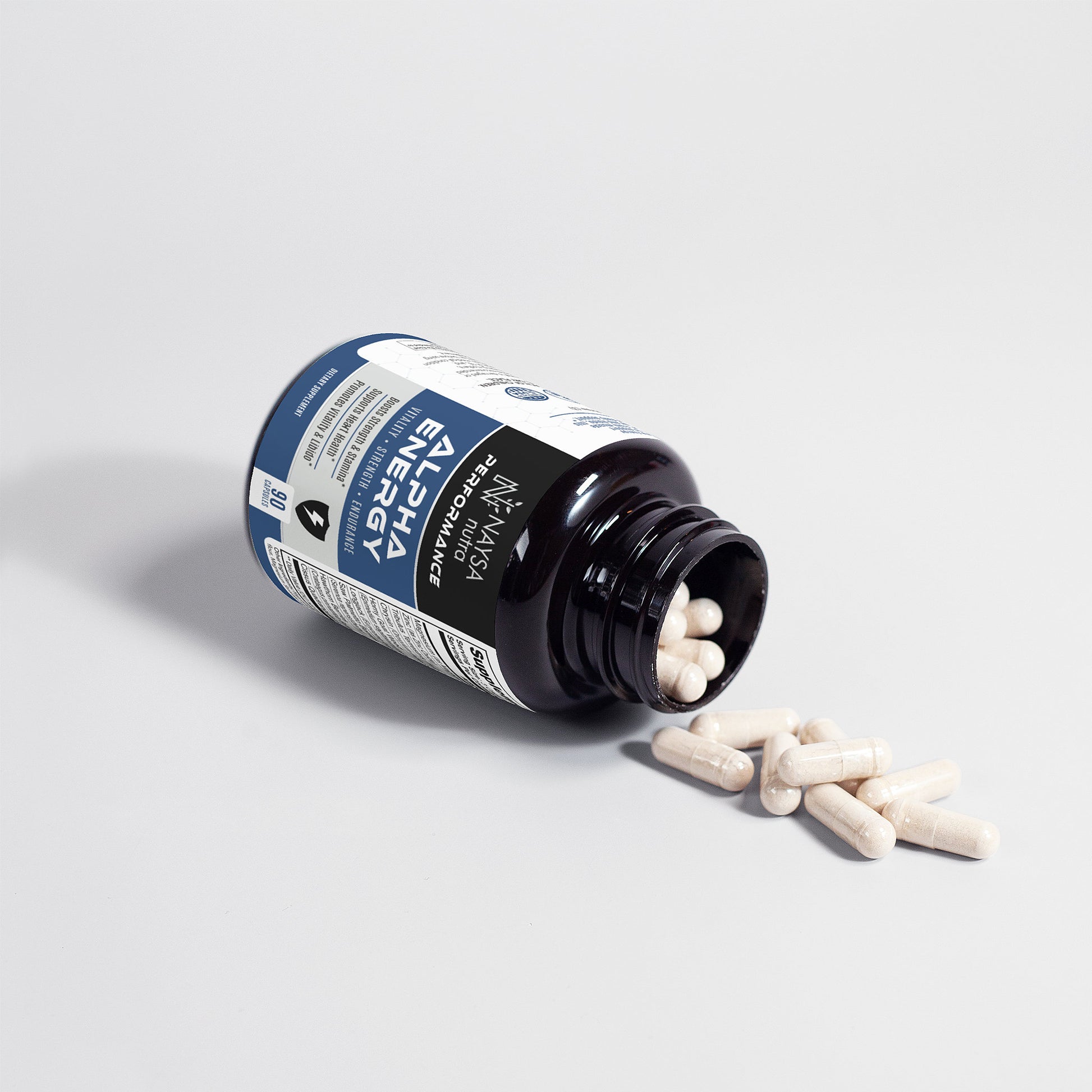 Bottle of alpha Energy supplements with pills spilling out on a light gray background